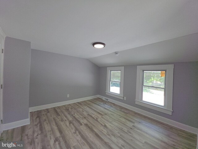 131 Vine St, Bridgeton, NJ 08302 - unfurnished room featuring vaulted ceiling, light wood-style flooring, and baseboards