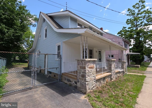 131 Vine St, Bridgeton, NJ 08302 - view of front of home with a gate and covered porch