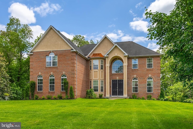 144 Cedar Ct, Woolwich Twp, NJ 08085 - view of front of property featuring a front lawn, brick siding, and stucco siding