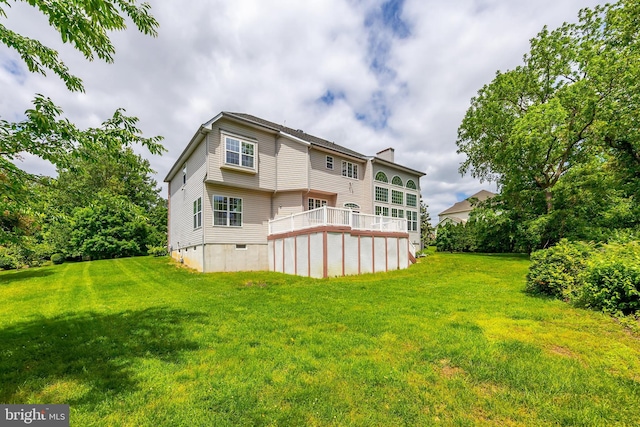 144 Cedar Ct, Woolwich Twp, NJ 08085 - back of house featuring a chimney, a yard, and crawl space