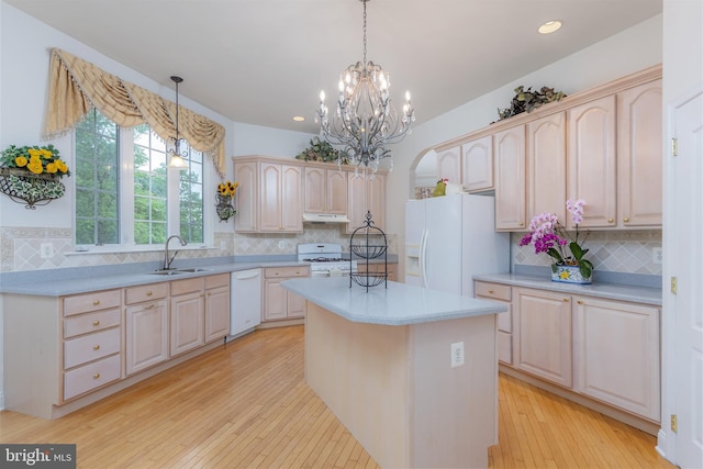 144 Cedar Ct, Woolwich Twp, NJ 08085 - kitchen featuring white appliances, a sink, under cabinet range hood, decorative backsplash, and recessed lighting