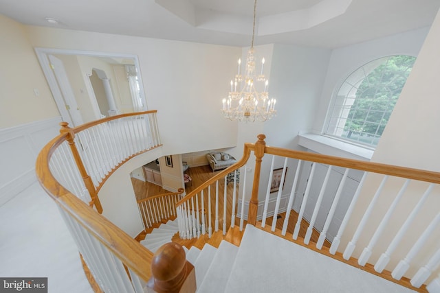 144 Cedar Ct, Woolwich Twp, NJ 08085 - stairway with a chandelier and a raised ceiling