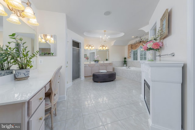 144 Cedar Ct, Woolwich Twp, NJ 08085 - full bathroom with a chandelier, a garden tub, tile patterned flooring, a shower stall, and vanity