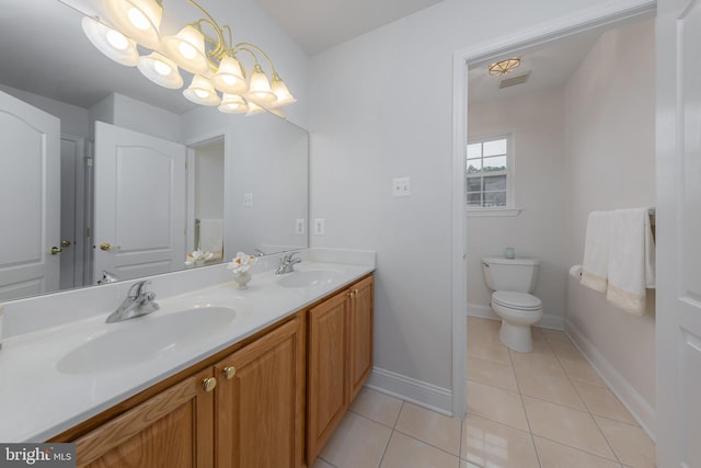 144 Cedar Ct, Woolwich Twp, NJ 08085 - full bath with double vanity, tile patterned flooring, toilet, and baseboards