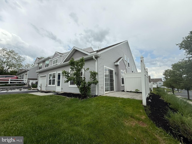 87 Courtyard Dr, Carlisle, PA 17013 - view of side of property featuring a garage and a yard