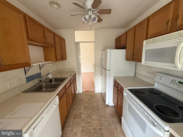 87 Courtyard Dr, Carlisle, PA 17013 - kitchen featuring white appliances, a sink, brown cabinets, and ceiling fan