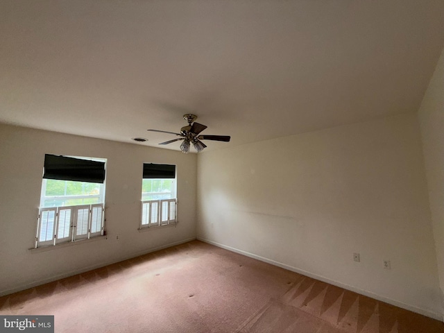 87 Courtyard Dr, Carlisle, PA 17013 - spare room featuring light carpet, baseboards, and ceiling fan