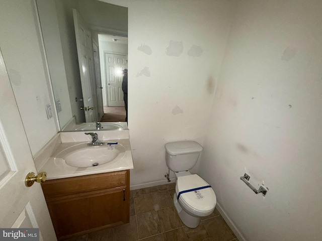 87 Courtyard Dr, Carlisle, PA 17013 - half bath with toilet, vanity, tile patterned flooring, and baseboards