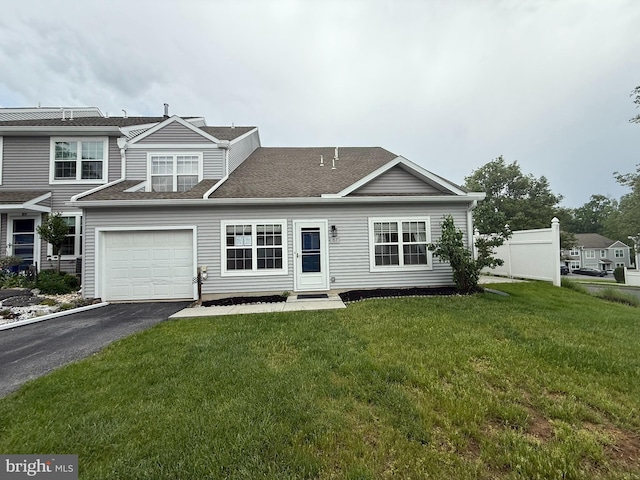 87 Courtyard Dr, Carlisle, PA 17013 - view of front facade with driveway, a front yard, and roof with shingles