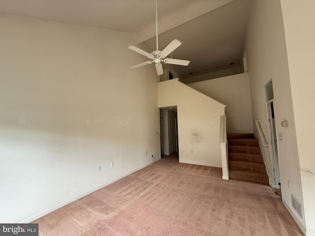 87 Courtyard Dr, Carlisle, PA 17013 - unfurnished living room featuring high vaulted ceiling, light colored carpet, a ceiling fan, beam ceiling, and stairway