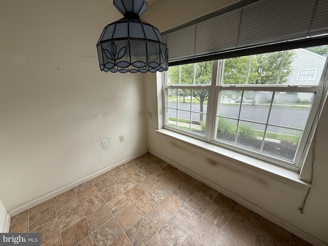 87 Courtyard Dr, Carlisle, PA 17013 - unfurnished dining area with baseboards and stone finish floors