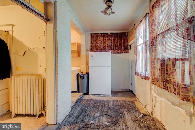 1646 Gales St NE, Washington, DC 20002 - kitchen featuring freestanding refrigerator, radiator, and crown molding