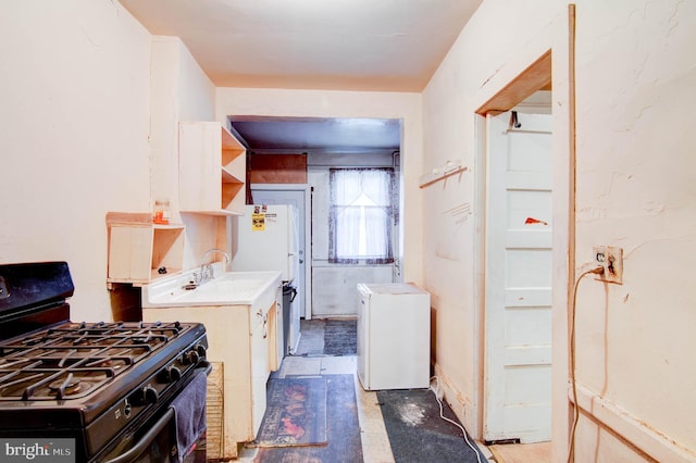 1646 Gales St NE, Washington, DC 20002 - kitchen with black gas range, refrigerator, light countertops, and open shelves