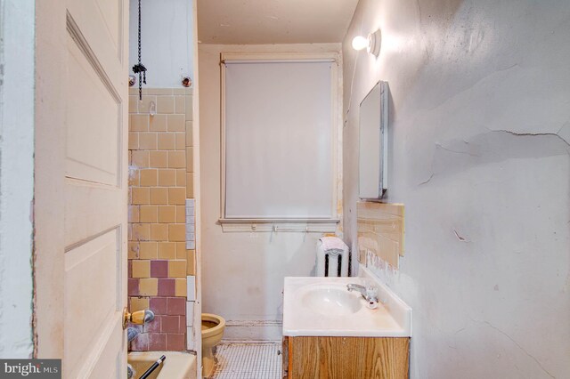 1646 Gales St NE, Washington, DC 20002 - bathroom with tile walls, toilet, and vanity