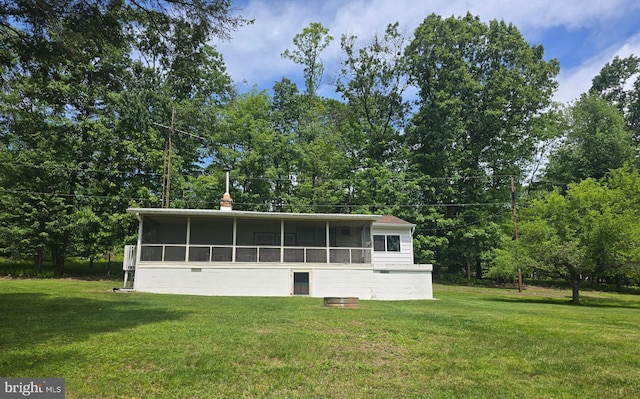 11 Maxwill Ln, Landisburg, PA 17040 - rear view of property featuring a sunroom, a lawn, and a chimney
