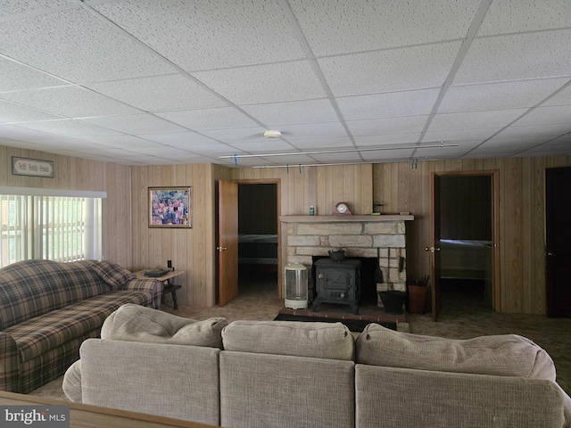 11 Maxwill Ln, Landisburg, PA 17040 - living area with a drop ceiling, wooden walls, a wood stove, and carpet