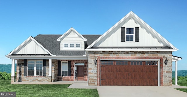 567 Lumber St, Littlestown, PA 17340 - view of front of home featuring board and batten siding, stone siding, a standing seam roof, driveway, and metal roof