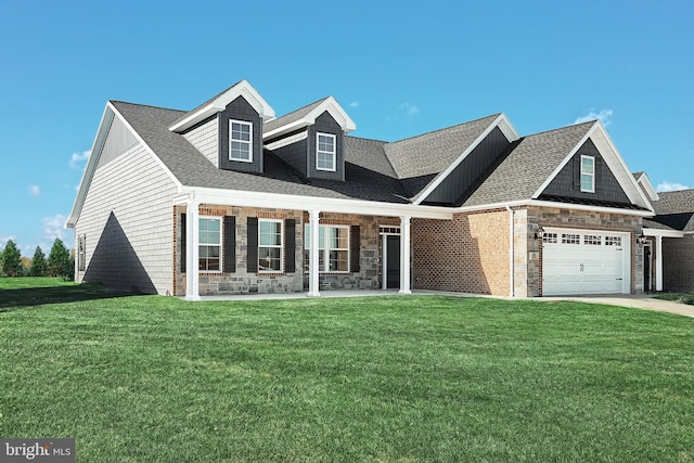 567 Lumber St, Littlestown, PA 17340 - view of front of property with a front yard, stone siding, driveway, roof with shingles, and a garage