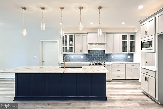 567 Lumber St, Littlestown, PA 17340 - kitchen with a sink, built in microwave, backsplash, light stone countertops, and recessed lighting