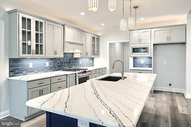 567 Lumber St, Littlestown, PA 17340 - kitchen featuring a sink, white gas stove, gray cabinetry, a center island with sink, and recessed lighting