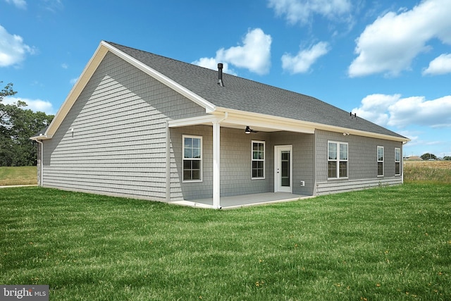 567 Lumber St, Littlestown, PA 17340 - back of property with a patio, a yard, roof with shingles, and a ceiling fan