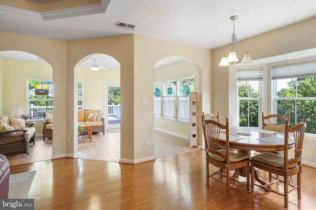 35206 Seagrass Plantation Ln, Dagsboro, DE 19939 - dining area featuring arched walkways and plenty of natural light
