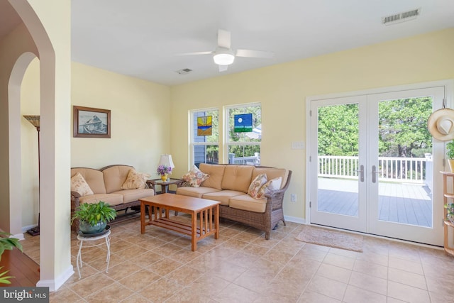 35206 Seagrass Plantation Ln, Dagsboro, DE 19939 - living area with ceiling fan, arched walkways, french doors, baseboards, and light tile patterned floors