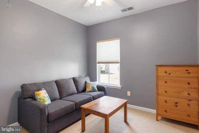 35206 Seagrass Plantation Ln, Dagsboro, DE 19939 - living room featuring a ceiling fan, light carpet, and baseboards