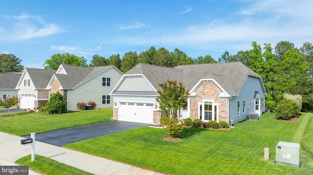 35206 Seagrass Plantation Ln, Dagsboro, DE 19939 - view of front of property with stone siding, driveway, a garage, and a front yard