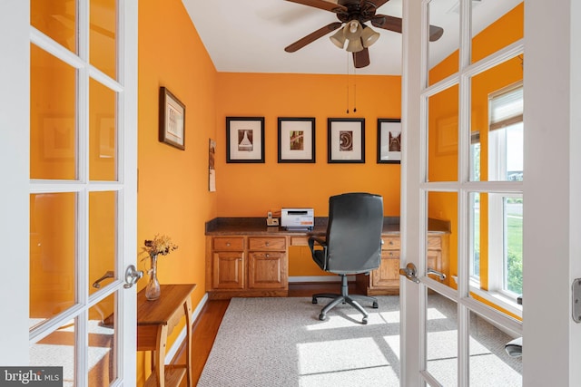 35206 Seagrass Plantation Ln, Dagsboro, DE 19939 - carpeted home office featuring a ceiling fan, french doors, baseboards, and built in desk