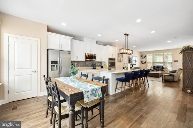 10744 Hinton Way, Manassas, VA 20112 - dining space with wood finished floors and recessed lighting