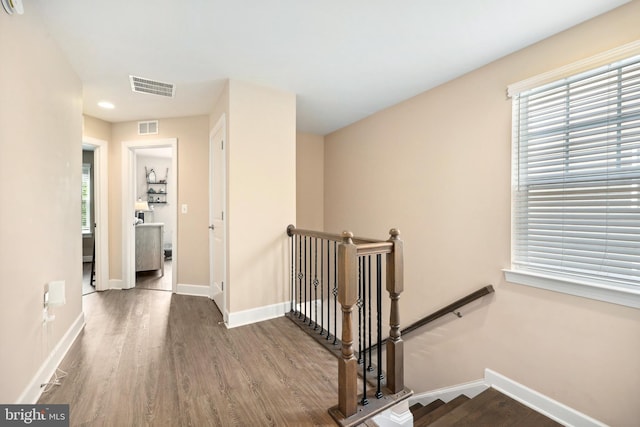 10744 Hinton Way, Manassas, VA 20112 - corridor featuring an upstairs landing, wood finished floors, and baseboards