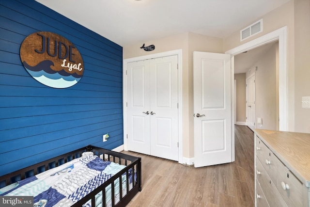 10744 Hinton Way, Manassas, VA 20112 - bedroom with wood finished floors, a closet, wooden walls, and baseboards