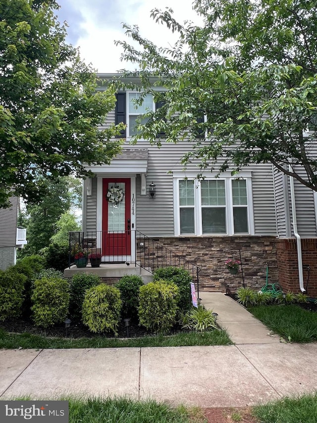 10744 Hinton Way, Manassas, VA 20112 - view of property hidden behind natural elements featuring stone siding