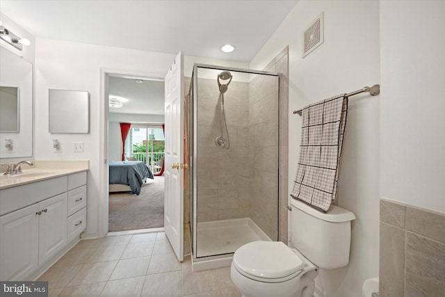 6124 Aster Haven Cir, Haymarket, VA 20169 - ensuite bathroom featuring vanity, toilet, a stall shower, and tile patterned flooring