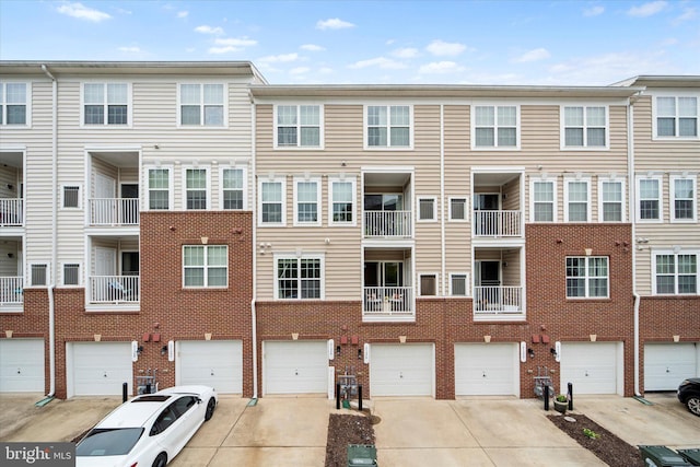 6124 Aster Haven Cir, Haymarket, VA 20169 - view of building exterior with driveway and an attached garage