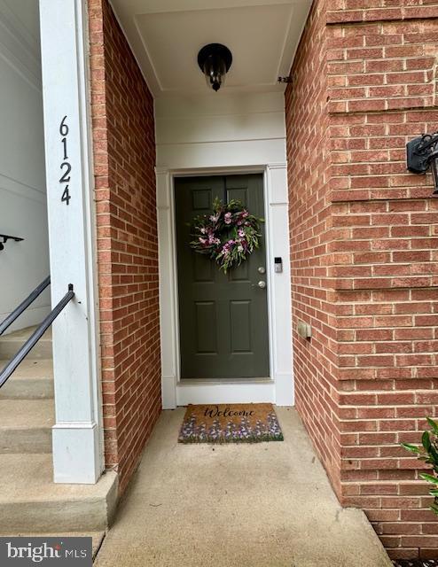 6124 Aster Haven Cir, Haymarket, VA 20169 - property entrance featuring brick siding