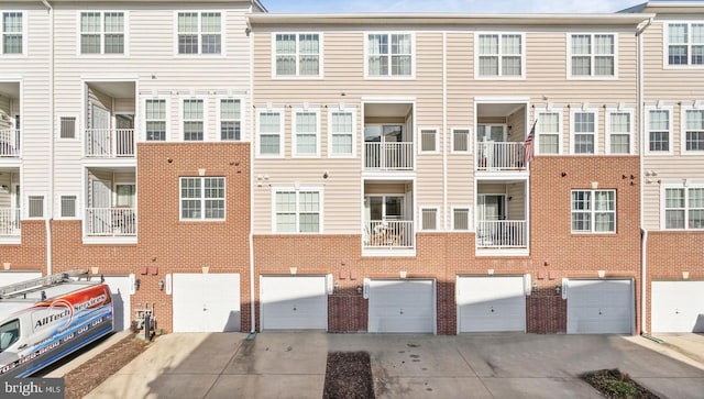 6124 Aster Haven Cir, Haymarket, VA 20169 - view of building exterior featuring driveway and an attached garage