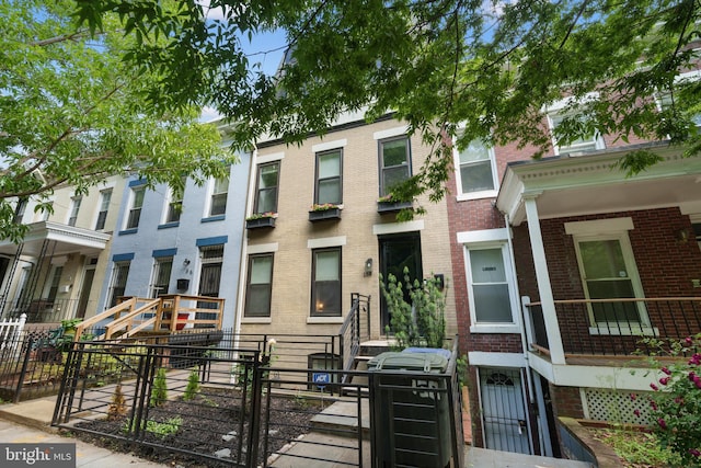 158 Bryant St NW Unit 2, Washington, DC 20001 - townhome / multi-family property with brick siding, a fenced front yard, and a gate