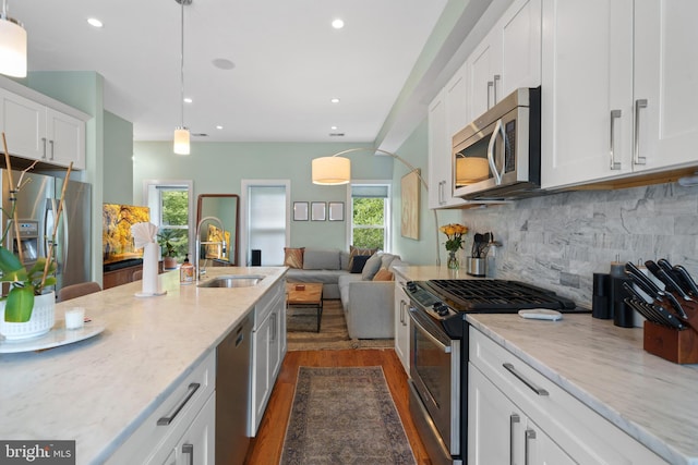 158 Bryant St NW Unit 2, Washington, DC 20001 - kitchen featuring stainless steel appliances, a sink, dark wood-style floors, plenty of natural light, and recessed lighting