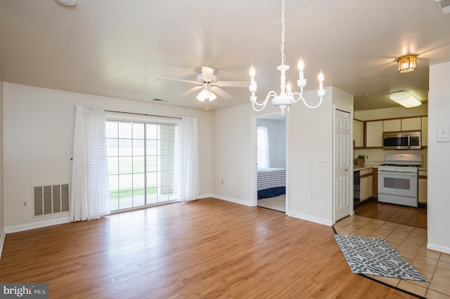 1310 Sheridan Pl Unit 108-17, Bel Air, MD 21015 - kitchen with white gas range oven, stainless steel microwave, light wood-type flooring, ceiling fan, and baseboards
