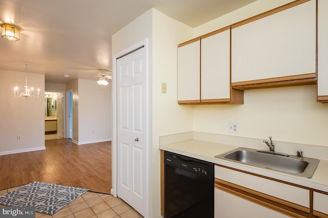 1310 Sheridan Pl Unit 108-17, Bel Air, MD 21015 - kitchen with dishwasher, a sink, white cabinetry, a chandelier, and light countertops