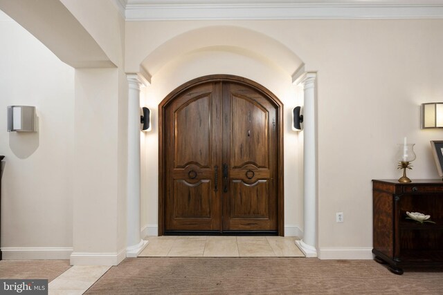 913A Caroline St, Fredericksburg, VA 22401 - foyer featuring arched walkways, ornate columns, light colored carpet, and baseboards