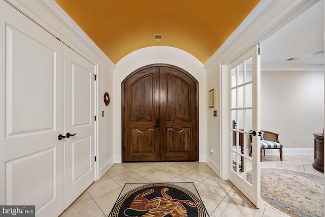 913A Caroline St, Fredericksburg, VA 22401 - entryway with french doors, arched walkways, light tile patterned floors, baseboards, and ornamental molding