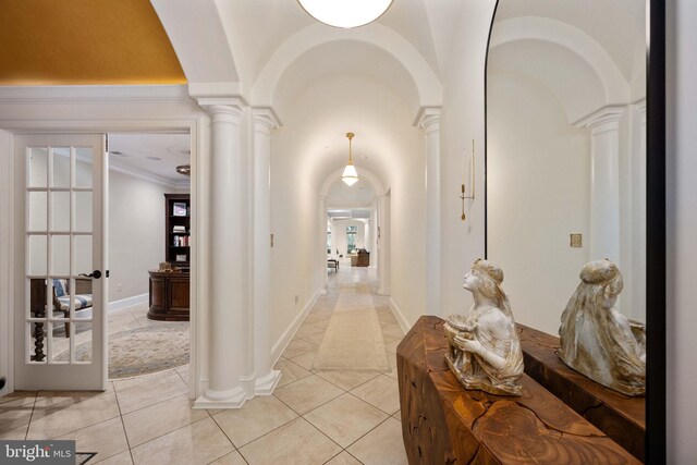 913A Caroline St, Fredericksburg, VA 22401 - hall featuring decorative columns, light tile patterned flooring, arched walkways, crown molding, and baseboards