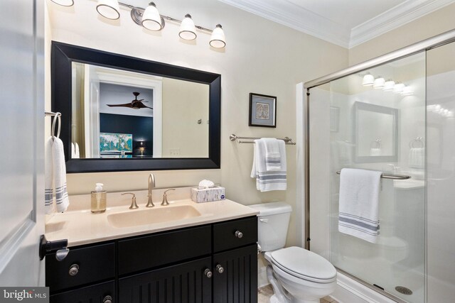 913A Caroline St, Fredericksburg, VA 22401 - bathroom featuring ornamental molding, vanity, a shower stall, and toilet