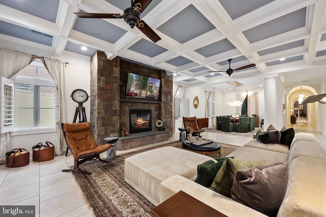 913A Caroline St, Fredericksburg, VA 22401 - living area with a ceiling fan, ornate columns, a stone fireplace, coffered ceiling, and beam ceiling