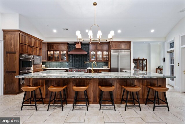 913A Caroline St, Fredericksburg, VA 22401 - kitchen with built in appliances, wall chimney range hood, tasteful backsplash, a sink, and recessed lighting