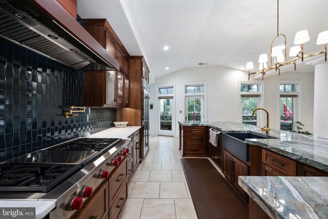 913A Caroline St, Fredericksburg, VA 22401 - kitchen featuring wall chimney exhaust hood, a sink, dishwashing machine, backsplash, and stainless steel gas cooktop