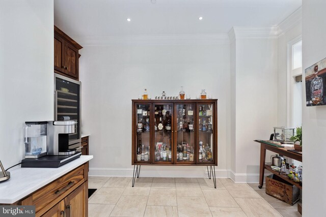 913A Caroline St, Fredericksburg, VA 22401 - bar area featuring crown molding, wine cooler, baseboards, recessed lighting, and light tile patterned floors